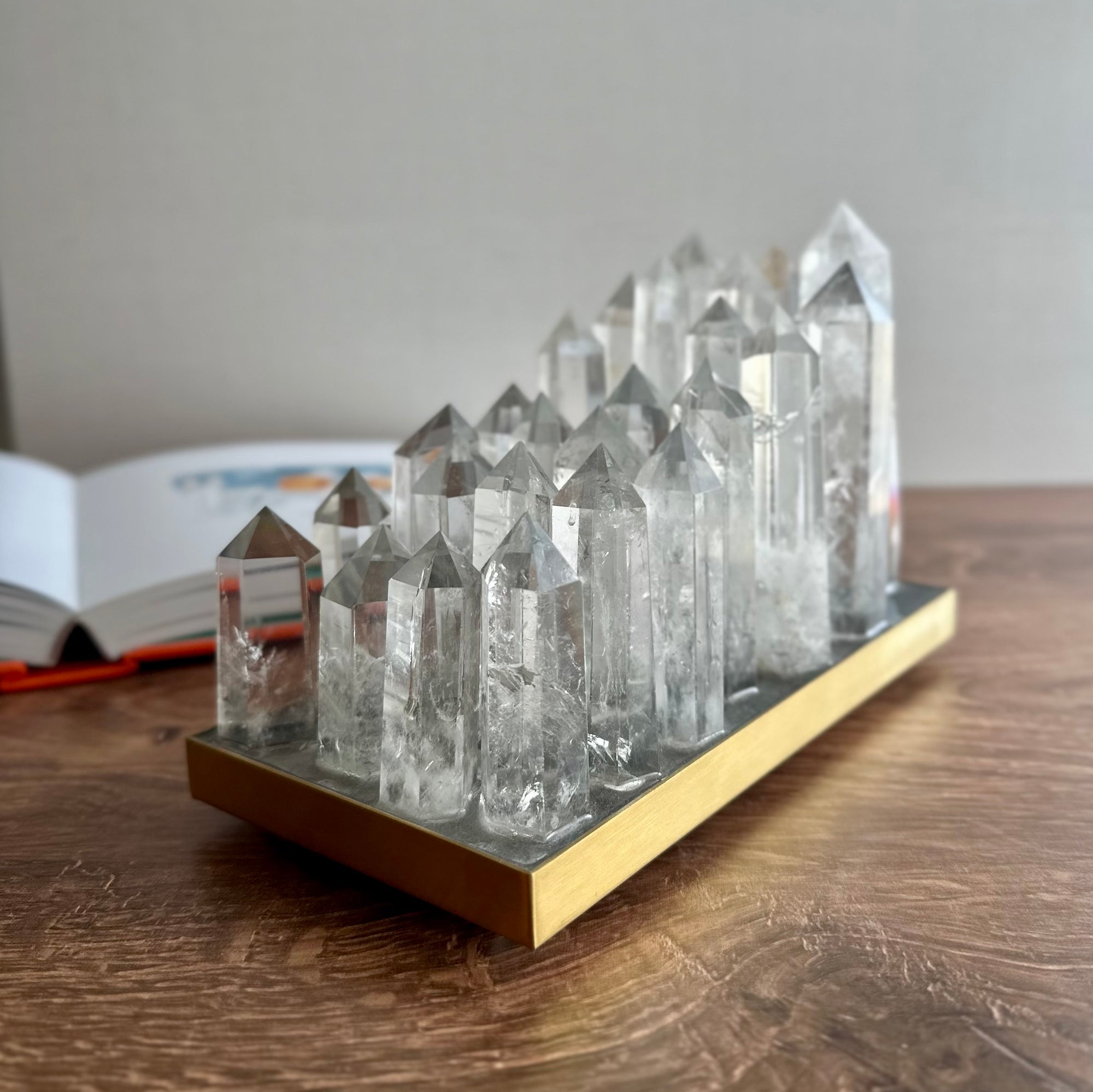 Clear quartz crystal lamp on brushed brass base with LED light